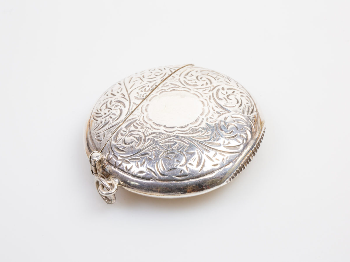 Vintage sterling silver vesta case. Unusual circular vesta with an empty cartouche for personalisation . Hallmarked 925 for sterling silver on the inside rim. c1970s. Measures approximately 50mm in diameter. Main photo of vesta with lid closed and shown with hinged side to the foreground