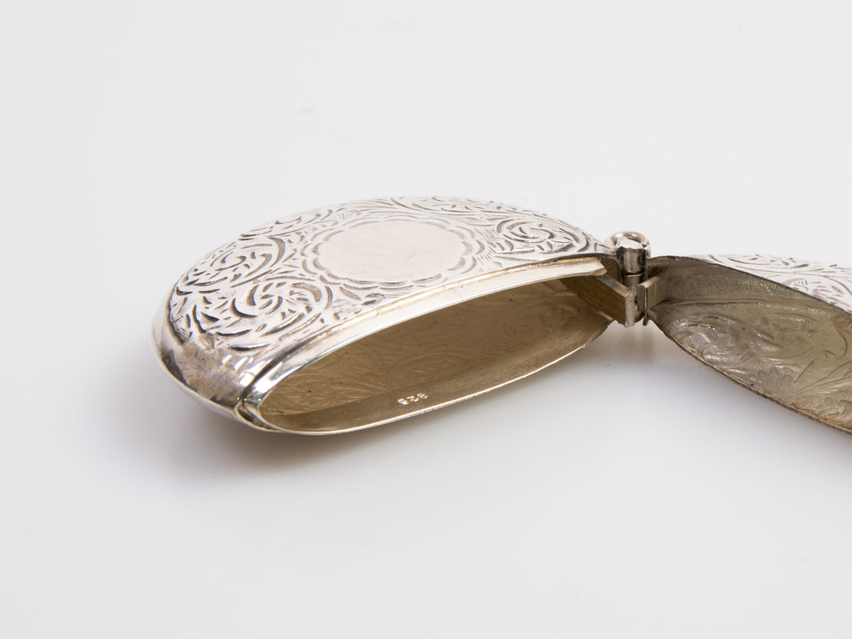 Vintage sterling silver vesta case. Unusual circular vesta with an empty cartouche for personalisation . Hallmarked 925 for sterling silver on the inside rim. c1970s. Measures approximately 50mm in diameter. Photo of vesta on its side with lid open with 925 hallmark visible (Lid open to the right)