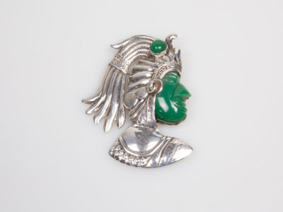 925 Sterling silver brooch by Plata. Intricate design brooch of an Inca warrior in profile with Mexican apple green jade colour Bakelite face and headgear adornment and moving silver earring. Signed Sterling Plata 925 Mexico to the back. Main photo showing full brooch from the front