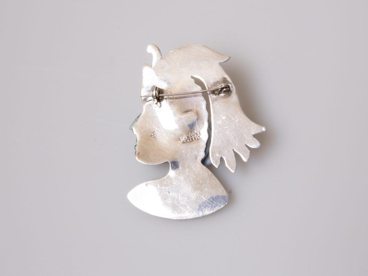 925 Sterling silver brooch by Plata. Intricate design brooch of an Inca warrior in profile with Mexican apple green jade colour Bakelite face and headgear adornment and moving silver earring. Signed Sterling Plata 925 Mexico to the back. Photo of back of brooch