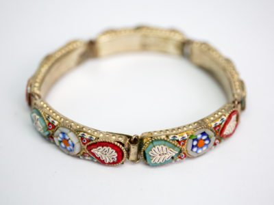 Vintage Italian micro mosaic bracelet. 5 panel white metal bracelet inlaid with micro mosaic beads in a pretty floral design. In very good order throughout with only 1 small bead missing. Main photo of bracelet shown from clasp side with bracelet done up