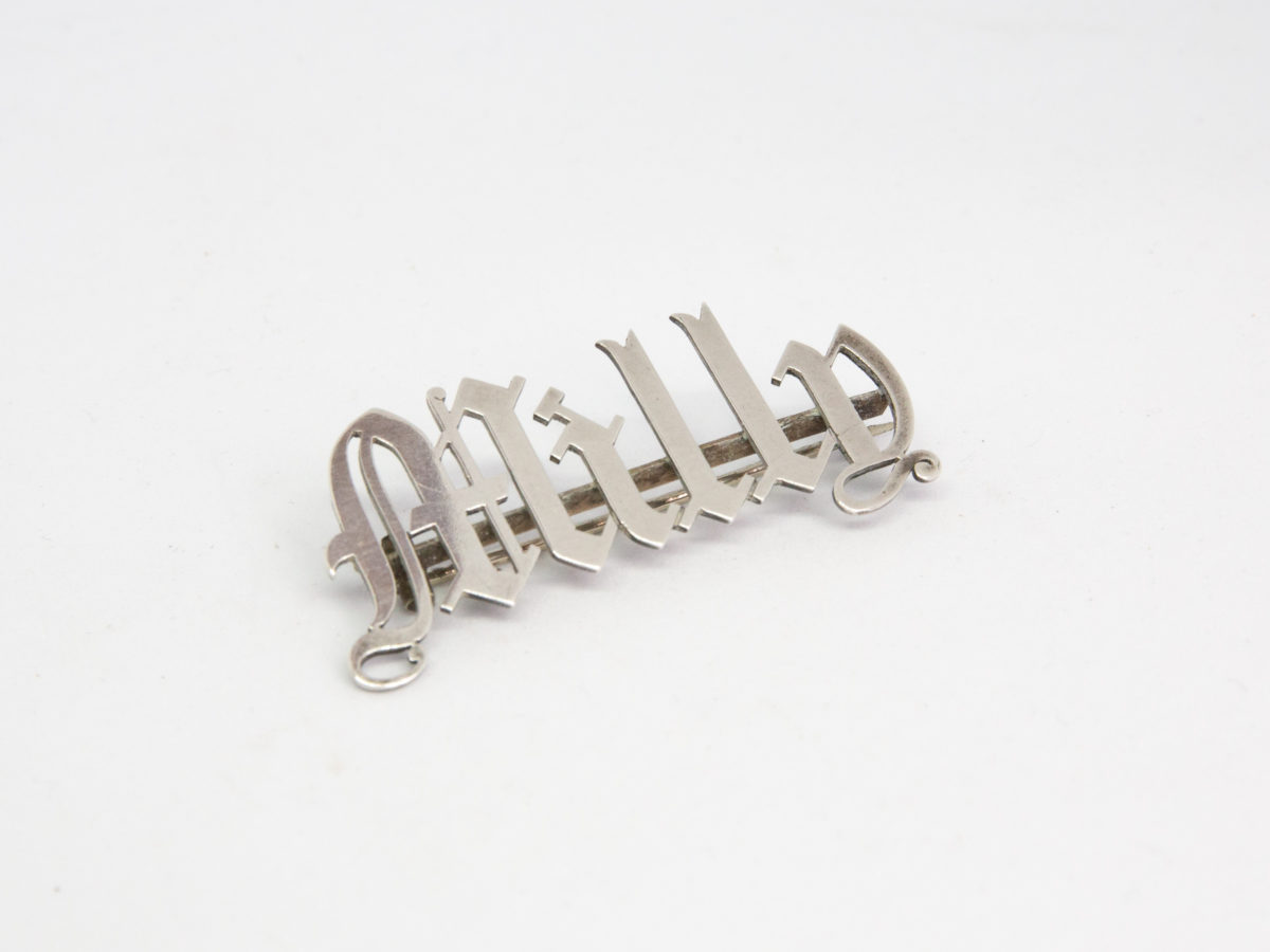 Victorian sterling silver name brooch. Name brooches were highly fashionable in the Victorian era. Beautifully crafted in sterling silver, this one in gothic style is for Milly - lucky Milly! Hallmarked to the back but mostly obscured by the bar pin which is a later addition. Photo of brooch seen from the front but set diagonally with letter M to the bottom left of photo and letter y to top right