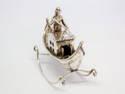 Vintage Dutch silver novelty gondolier. Solid silver decorative piece with full Dutch hallmark to the base. Main photo of gondolier with front end of gondola facing bottom left