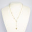 9 karat gold necklace with hearts. Very fine modern 9 karat gold chain embellished with small hearts and baubles and a dangling heart to the end. Measures 410mm long and weighs 1.7gms. Box included. Main photo of necklace displayed on a light-coloured display stand