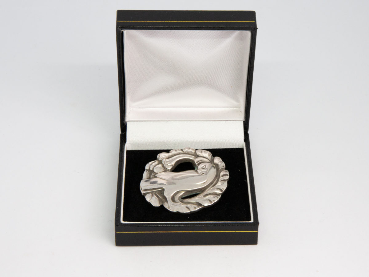Vintage Georg Jensen dove brooch. Iconic early Georg Jensen dove brooch with No.165 stamped to the back. Made for import to London Bond St shop 1936-44. Photo of brooch displayed in open box.