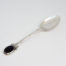 c1978 Sterling silver and Blue John spoon. Single sterling silver teaspoon with an oval Blue John stone to the handle tip. Nice column design to the handle stem. Main photo of spoon with spoon bowl facing up and blue John stone at tip of handle to the bottom left of photo