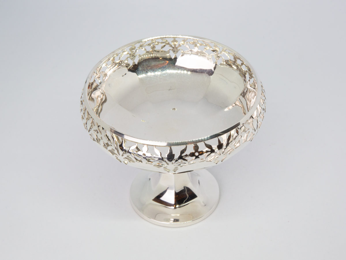 Art Deco sterling silver tazza. Very sweet tazza with pierced work to the top of the bowl. Made by Adey Bros Ltd of Birmingham and dates to 1927. Full hallmark to the outside of bowl. Measures 55mm in diameter at base and 95mm at opening at top. Photo looking down into the tazza bowl with just a little of the foot visible