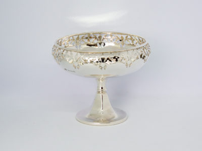 Art Deco sterling silver tazza. Very sweet tazza with pierced work to the top of the bowl. Made by Adey Bros Ltd of Birmingham and dates to 1927. Full hallmark to the outside of bowl. Measures 55mm in diameter at base and 95mm at opening at top. Main photo of tazza seen from a near eye level angle