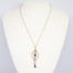 9 Karat rose gold pendant with garnet. c1910 Art Nouveau Lavaliere pendant with garnet and seed pearls on a fine 9 karat gold chain. Hallmarked 9ct on back of pendant and to the clasp. Pendant drop length 60mm and 20mm wide at widest area. Main photo of necklace displayed on a stand.