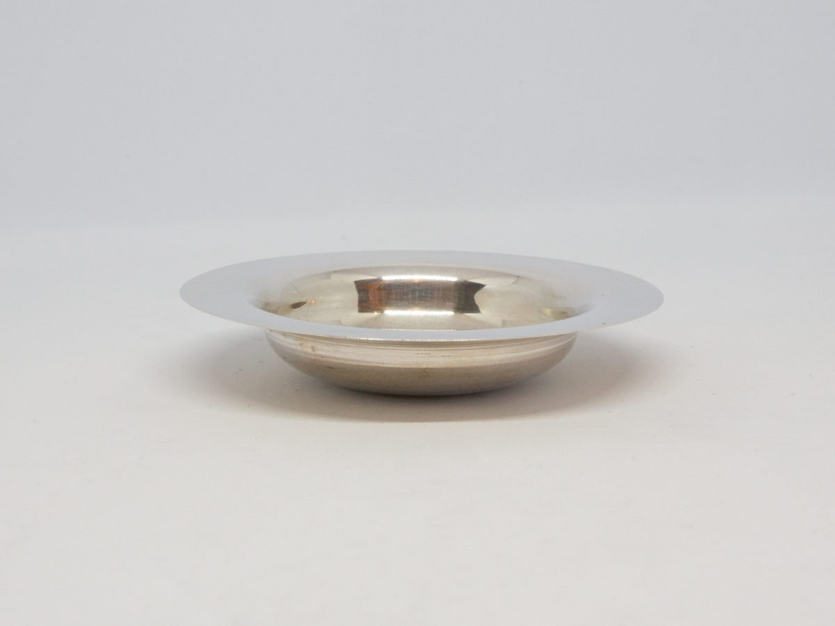 Vintage Scandinavian silver dish. Small round silver dish with a two-headed eagle to the centre. Hallmarked 830 Silver to the base. Measures 55mm at base and 82mm across the top. Photo of dish from an eye level angle showing the dish depth.