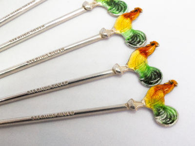 Set of 6 Art Deco cocktail sticks. Fine quality set of sterling silver cocktail sticks with a colourful enamel cockerel to the top. Each cockerel has a very slight variation of colouring so not all uniform. Hallmarked sterling silver on the stick below the cockerel. No original case. Each stick measures approximately 80mm at longest and weighs approximately 2.9gms. Main photo showing a close up shot of 3 cockerels and the slight colour variation and the sterling silver mark.
