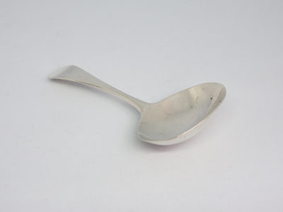 c1804 Sterling silver caddy spoon. Antique King George III sterling silver caddy spoon assayed in London by Peter, Ann & William Bateman. Full hallmark to the back of the handle. Caddy bowl measures approximately 46mm by 38mm and 12mm in depth. ~Main photo of spoon seen laid in a diagonal angle on a flat surface with spoon bowl facing the bottom right of photo