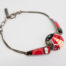 Modern metal & enamel ladybird bracelet. Fun and colourful ladybird bracelet in enamel set on white metal. Slightly adjustable from 160mm to185mm. Central section measures 17mm in diameter. Lovely gift item for children of all ages! Main photo of bracelet laid flat with the ladybird to the bottom right of photo.