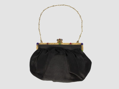Vintage black satin bag. Very sweet bag in black satin with a gilt metal chain handle and frame studded with coloured stones. c1920s-1930s. In good order for age. Chain drop length approximately 150mm. Main photo showing bag with chain handle spread out and clasp opening side in the foreground.