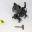 1950s Tri-Ang Minic clockwork cat. Fun novelty clockwork cat toy that chases a butterfly. Oddly realistic in detail. No original box or key. Key is included but not the original one. Cat measures approximately 100mm long, 107mm tall (at head) and 65mm wide. Main photo of cat appearing to be looking at butterfly with key in the foreground. Cat is facing bottom left of photo.