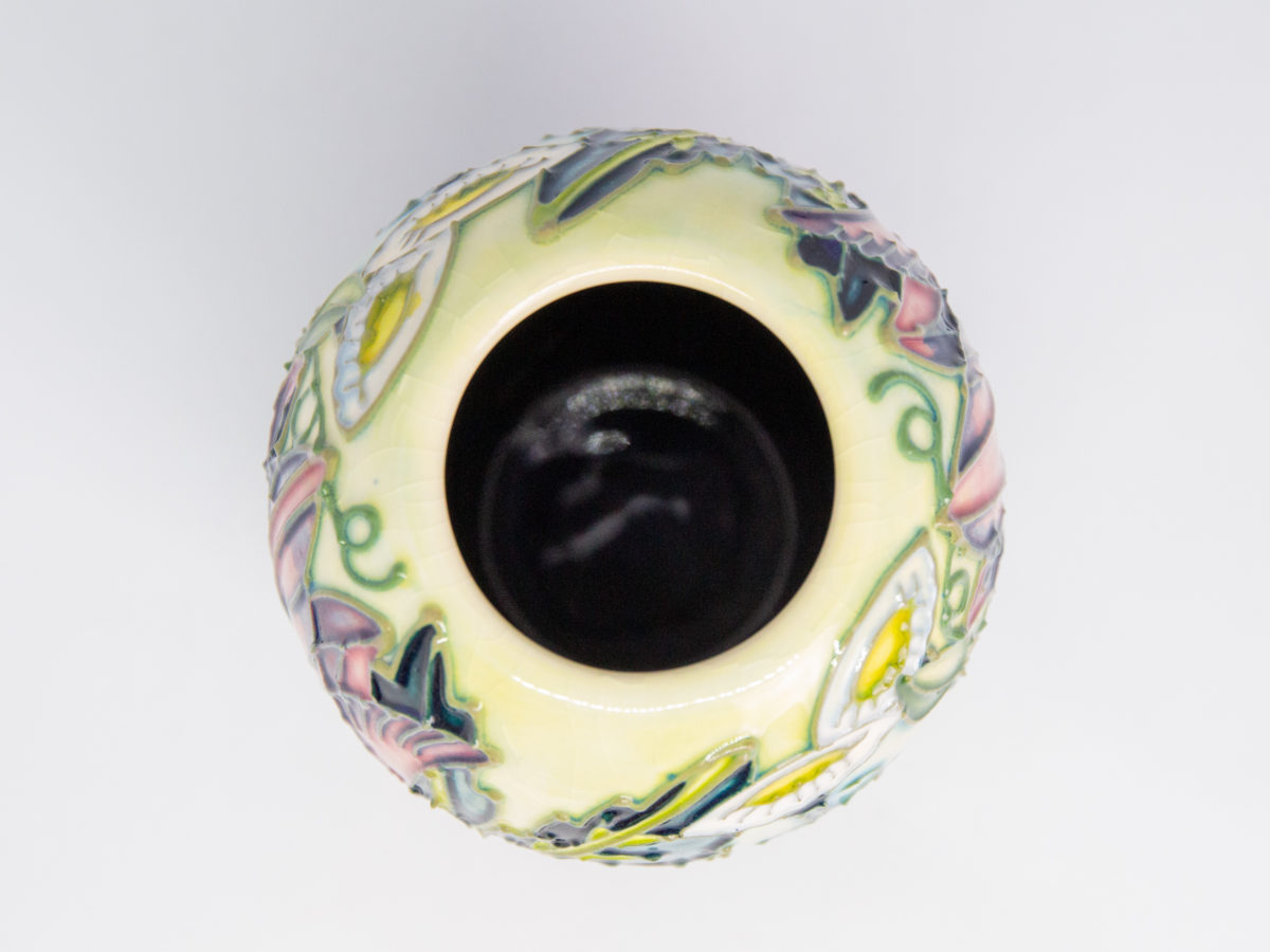 Moorcroft 'Castle Garden' vase. Issued in a limited edition of 500, this vase was designed by Debbie Hancock and dated c1997. Measures 45mm in diameter to the base, 75mm in diameter at widest part and 38mm in diameter at opening. Photo looking straight down into vase interior.