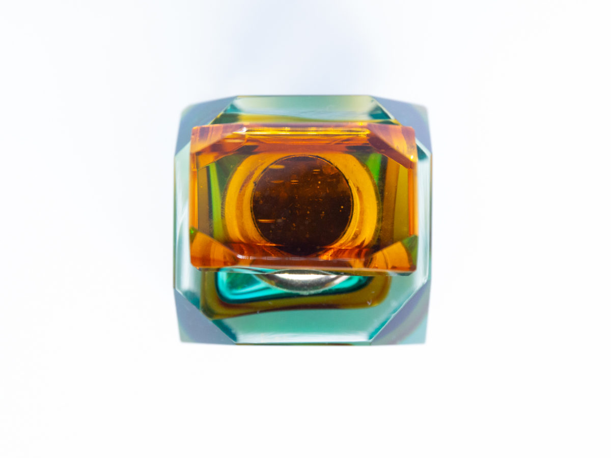 Mid century modern Murano glass perfume bottle. Small stunning Murano Sommerso perfume bottle in burnt amber, aqua and clear glass. Screw top stopper with brass neck and clear glass applicator. A really beautiful piece of modern glass art attributed to Flavio Poli. A play on colour photo - looking down at the top of the bottle (with amber stopper in place & contrasting against the aqua)