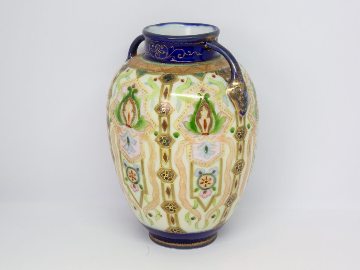 Hand-painted Noritake vase from the Art Deco era. Here we have a beautifully hand-painted bulbous vase with 2 fine handles and decorated in an Oriental Art Deco pattern. In superb condition. Date estimated to between 1918-1921. Measures approximately 58mm in diameter at base and at mouth and 125mm at widest across the base of each handle. Photo of vase set at an angle.