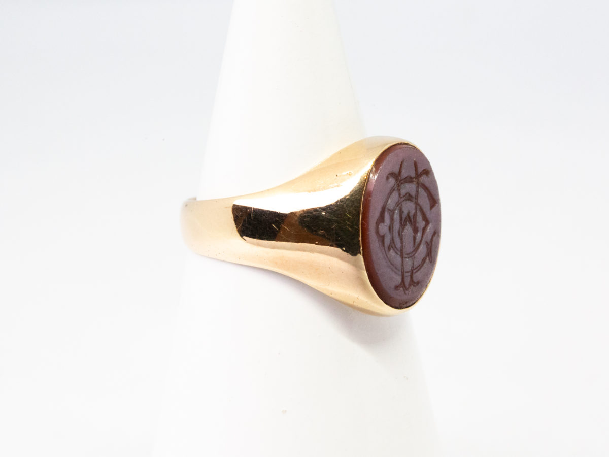 Vintage 9 karat gold seal ring. A nice solid ring in 9 karat gold with superimposed letters C, D & A in intaglio (hollow relief) to the agate stone. Hallmarked 9ct to inside band. Ring front measures approximately 14mm by 12mm. Box included. Ring size R / 8.5 Ring weight 8.9gms. Photo of ring on a cone shaped stand and seen with ring front facing right of photo.