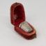 Sterling silver thimble in a fitted velvet case. Lovely sterling silver thimble in a fitted red velvet case with clasp. Fully hallmarked to the side of the thimble for c1927 Birmingham assay. Considerable wear to the velvet case. Thimble measures 20mm long and 16mm in diameter at opening. Thimble weight 2gms. Main photo of thinmle displayed in its fitted red velvet case and shown diagonally with case lid open to the top left of picture