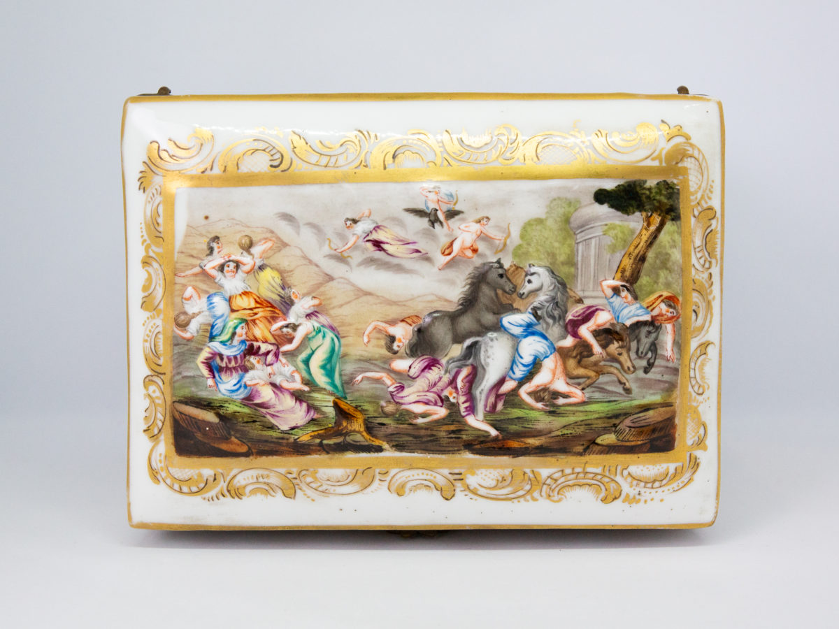Late 19th century Naples porcelain box. A heavy porcelain box moulded in high relief with scenes of scantily clad men and women disporting themselves in various ways. Beautifully hand-painted in bright vibrant colours and finished off with gilt accent. Photo of box lid showing the same decoration as the box front of cupids with arrows.