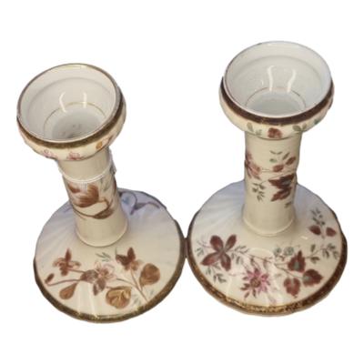 A beautiful pair of Limoges porcelain candlesticks with leaf pattern in brown with gold highlights. Each candlestick measures 150mm high and 100mm in diameter at base. Main photo of the 2 candlesticks side by side and shown looking down from a slight height.