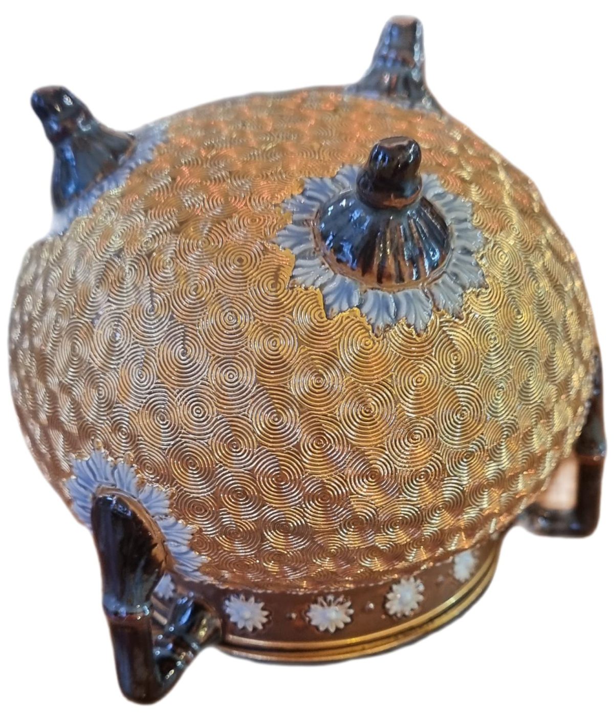 Royal Doulton pot circa 1904. Three Handled squat pot with gold spiral decoration to its body and brown glazed handles and rim with a touch of blue highlights. Photo of the base of the pot showing the 3 legs.
