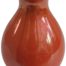 A Moorcroft lustre vase in vibrant orange circa 1907-26 the small baluster shape vase is a rare find. Main photo showing one area of vase from an eye level angle