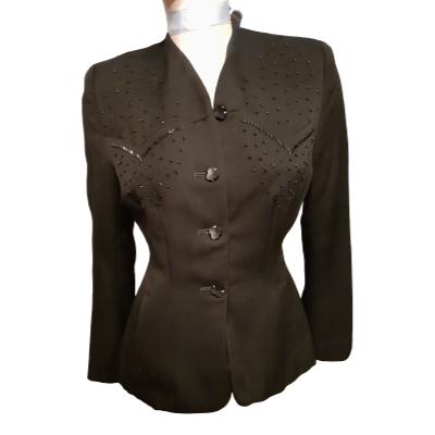 1940s black fitted jacket with bead embellishment on front. In excellent condition. Size 10. Main photo showing the jacket with buttons fastened from the front.