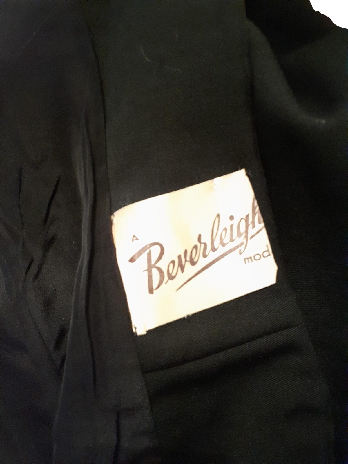 1940s black fitted jacket with bead embellishment on front. In excellent condition. Size 10. Close up photo of the makers label.