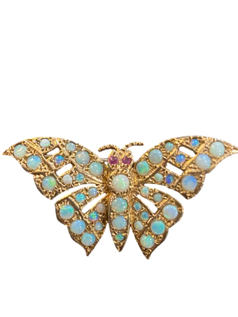 9ct gold opal brooch with ruby eyes Main photo looking at brooch front.