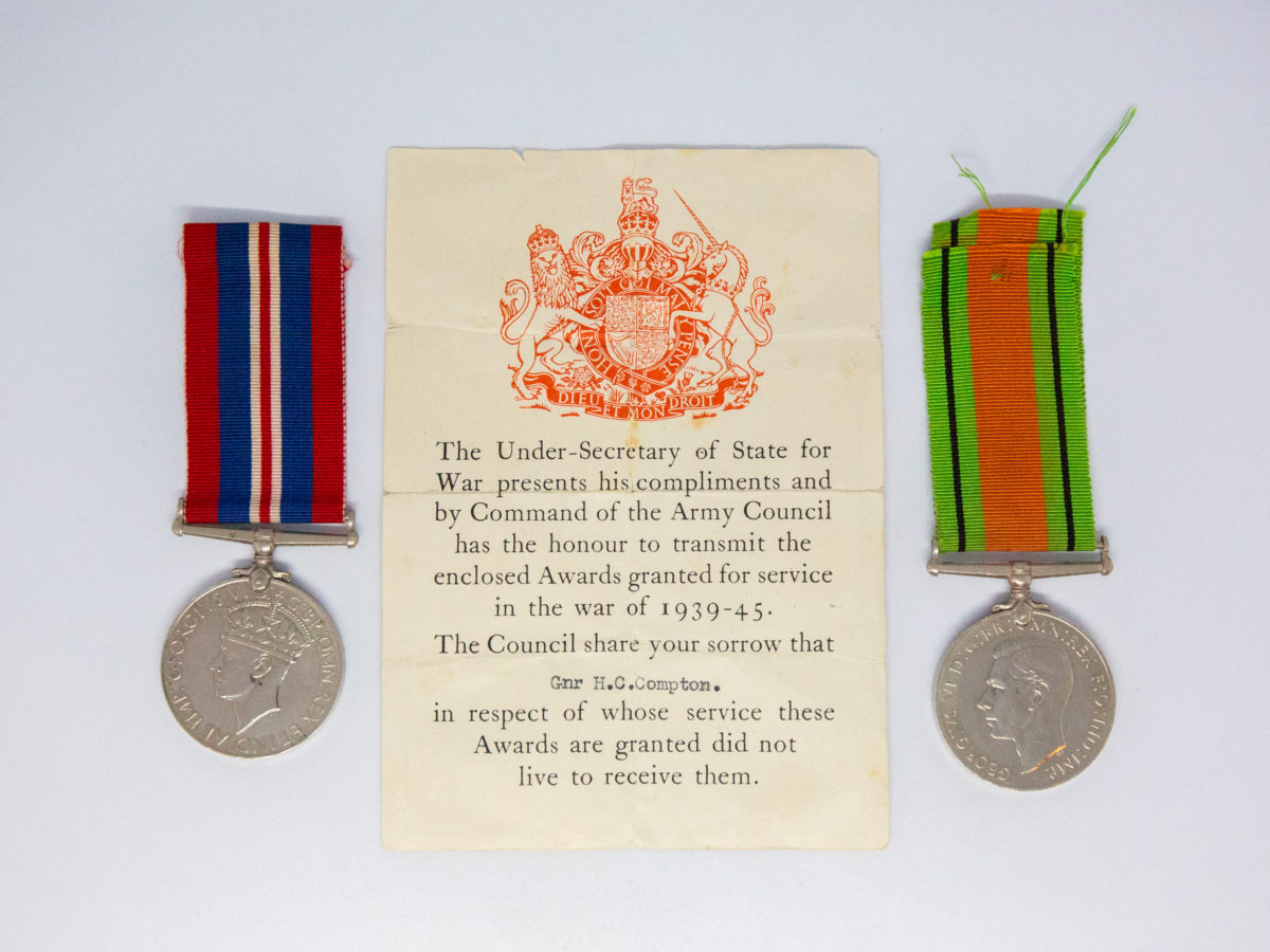 Un-issued Defence and War medal 1939-45. 2 medals from WWII namely The Defence medal and The War Medal. Both medals are un-issued. Small certificate from the Under-Secretary of State for War naming Gnr H. C. Compton who died in service. Each medal measures 36mm in diameter and are in excellent condition with ribbons in good condition. Main photo of medals on either side of the certificate showing the name of general who medals were sent to.