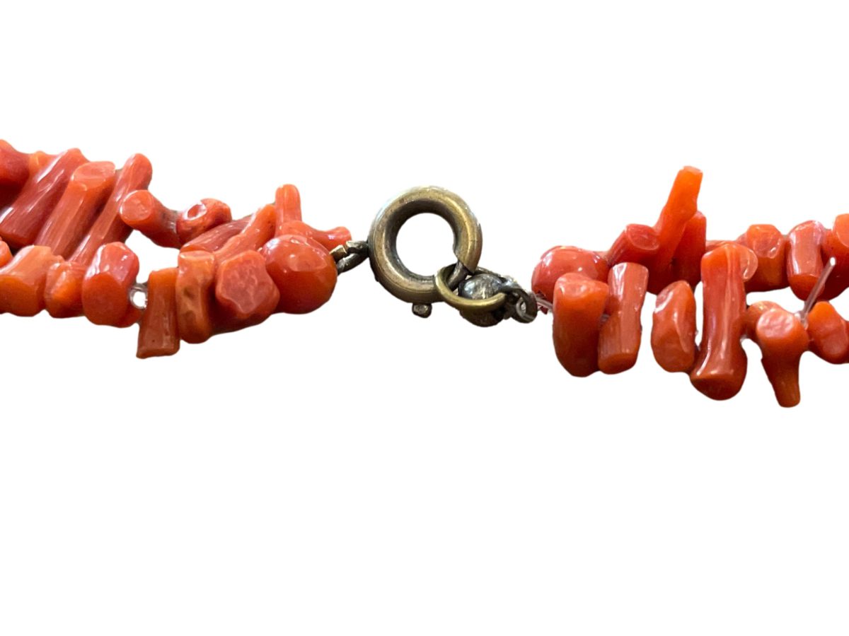 Vintage double strand branch coral necklace. Salmon red coral with longer branch coral to the front. Shorter strand measures 440mm and longer 550mm. Longer branch corals measure approx.38mm Photo of the brass clasp area with smaller red coral to either side.