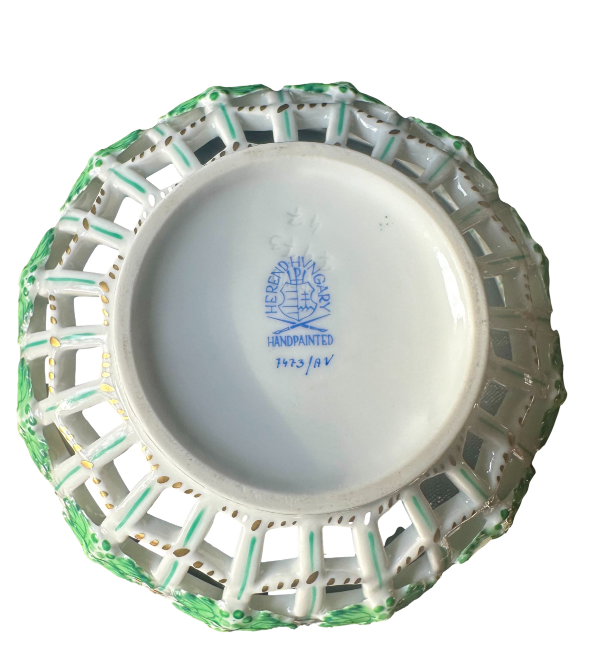 A vintage porcelain hand-painted bowl of lattice open work design by Herend of Hungary. Photo of base of bowl showing the makers stamp.