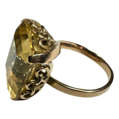 1930s / 40s Large faceted citrine ring set on 14 karat gold. c 1930s-1940s. Ring size O.5.  Dimensions 21mms x 17mms x 11 mms and weight 11.9 grams. Main photo of ring seen from a raised side angle showing the elaborate setting for the large stone.