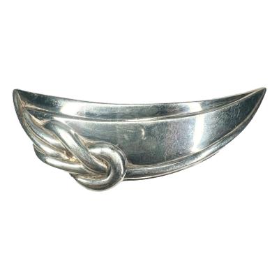 Vintage Christofle silver plate brooch. Large statement brooch made by renowned makers Christofle. Main photo showing brooch from the front with decorative knot detail to the left of the brooch front.