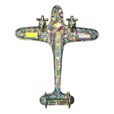 Rare vintage Butler & Wilson aurora borealis aeroplane brooch. Comes boxed. Measures approximately 58mm by 47mm. Main photo of aeroplane brooch seen from the front with nose end at the top and tail end at bottom of photo.