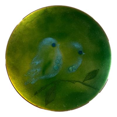 Small mid century enamel on copper plate by Judith Wedemeier USA c1960s. Beautiful green enamel dish decorated with 2 pale blue birds sat on a branch with raised bubble accents for the birds eyes and breasts. Signed Wedemeier USA to the base. There are 3 shallow indents to the base possibly from manufacturing process. Measures 125mm in diameter. Main photo of whole dish with whole image of the 2 little blue birds shown.