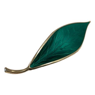 Vintage 925 gilt sterling silver leaf brooch by David Andersen Norway. Vibrant green enamel with intricate leaf vein detail. Full hallmark to the back. Main photo of brooch shown slightly angle with tip of leaf raised up to top right corner and end in bottom left.