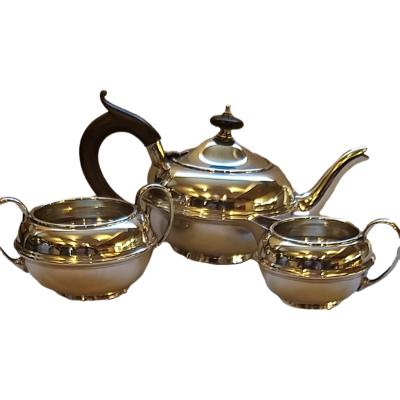 Early George V, Weight 400gms Hallmarked : London 1917 Silversmith : Samuel Walton Smith & Co. Teapot measures 200mm long, 105mm wide and 106mm tall. Milk jug measures 95mm long, 70mm wide and 52mm tall. Sugar bowl measures 105mm long, 86mm wide and 64mm tall.  COLLECT FROM STORE ONLY. Main photo of all 3 pieces displayed together with jug and sugar bowl to the foreground and tea pot at the back.