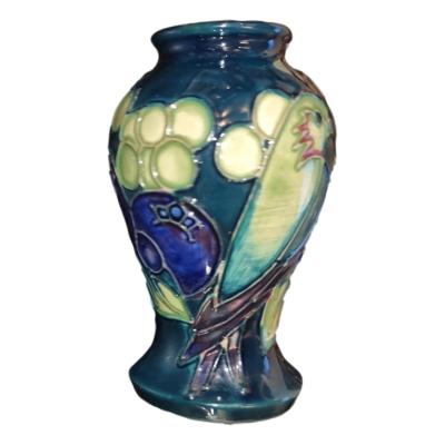 Moorcroft vase 'Finches' pattern is a sweet mini vase from the iconic Moorcroft factory. Main photo of vase seen from an eye level angle with finch bird visible to the right.