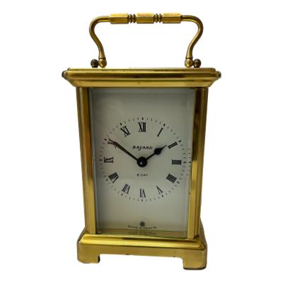 1970s French 8 day carriage clockby Bayard. In very good working order, this clock has been fully serviced by our inhouse clock man and is guaranteed for 1 year from date of purchase. Some minor signs of wear to the brass mostly to the back. Main photo showing clock front facing forward.