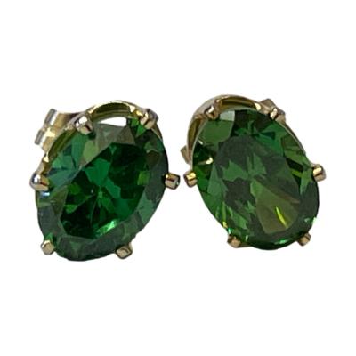 14 karat gold stud earrings set with half a carat of oval cut chrome diopside to each. Hallmark to the earring posts. Each stone measures approximately 6mm x 4.5mm. Main photo of earrings seen from the front.
