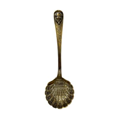 Antique French pierced silver ladle. Quality gilt silver ladle with very fine pierce work to ladle bowl and face of an aristocrat to handle tip. Worn hallmark to ladle handle at front above the bowl and 3 hallmarks to the back. Attributed for Paris assay c1819-1835. Bowl measures approximately 65mm in diameter. Main photo showing upright ladle.