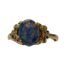 Fine quality 9 karat gold ring set with a black opal cabochon. The doublet triplet black opal emits flashes of pink, yellow & green and measures approximately 18mm by 9mm. Ring size O / 7.25. Main photo of ring seen from the front with no direct light on the black opal
