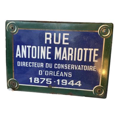 Genuine French vitreous enamel sheet steel street sign. Used on the Rue Antoine Mariotte in the Orleans district and removed for replacement, renaming or redevelopment work. White enamel is raised in relief with excellent definition. c1950s. COLLECT FROM STORE ONLY. Only photo of the street sign seen from the front. Reads in full: RUE ANTOINE MARIOTTE DIRECTEUR DU CONSERVATOIRE D'ORLEANS 1875-1944. (Antoine Mariotte being a famous composer, conductor and music administrator) There is a reflection of a light to the right of the sign-it is not part of the sign!