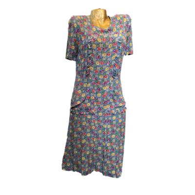 Beautiful petrol blue with unusual deco print, silky crepe dress. Button back, shirt sleeves and cute pockets either side. Dress at calf length and best for size 10 or small 12. In very good condition, no stains, holes etc. Main photo of dress shown in full displayed on a mannequin and forward facing.