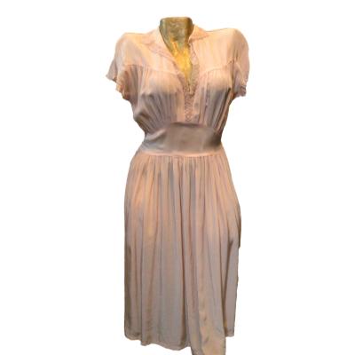 Pretty pale pink silky rayon 1930s day dress, length just below or on knee depending on your height. Good condition for age just a few wears on shoulder but reinforced slightly. Best for todays sizing 10 -12. Main photo of whole dress displayed on a mannequin and seen front facing.