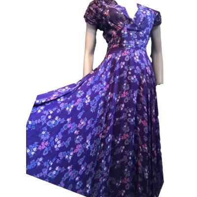 This is an original from the 1970s by infamous designer RADLEY who joined forces with OSSIE CLARK earlier in the 70s where he got his ideas. Plunging neckline and so much fabric in the skirt in a fine purple chiffon crepe and lined. Quite long probably ankle length on most. No faults in good condition. Size 8. Main photo of dress shown in full with left hand side fanned out to show the ample fabric. Dress is shown slightly off to the right.