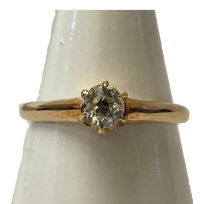 10 karat rose gold and diamond ring. Single brilliant round cut diamond set on a raised crown. Hallmarked 10k to inside band. Ring size N / 6.75. Small black velvet box included. Main photo of ring displayed on a cone shaped stand with ring front to the centre and facing the camera.